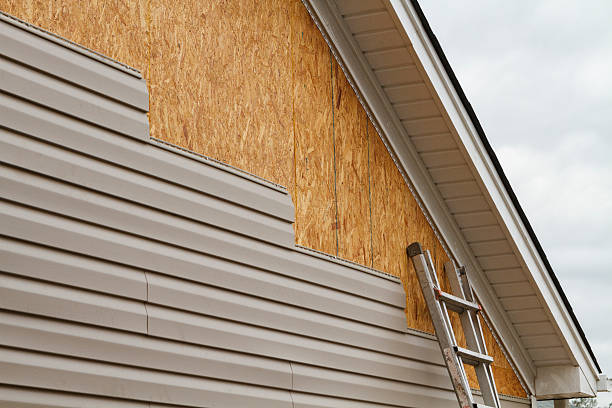 Vinyl siding partially applied to a house.